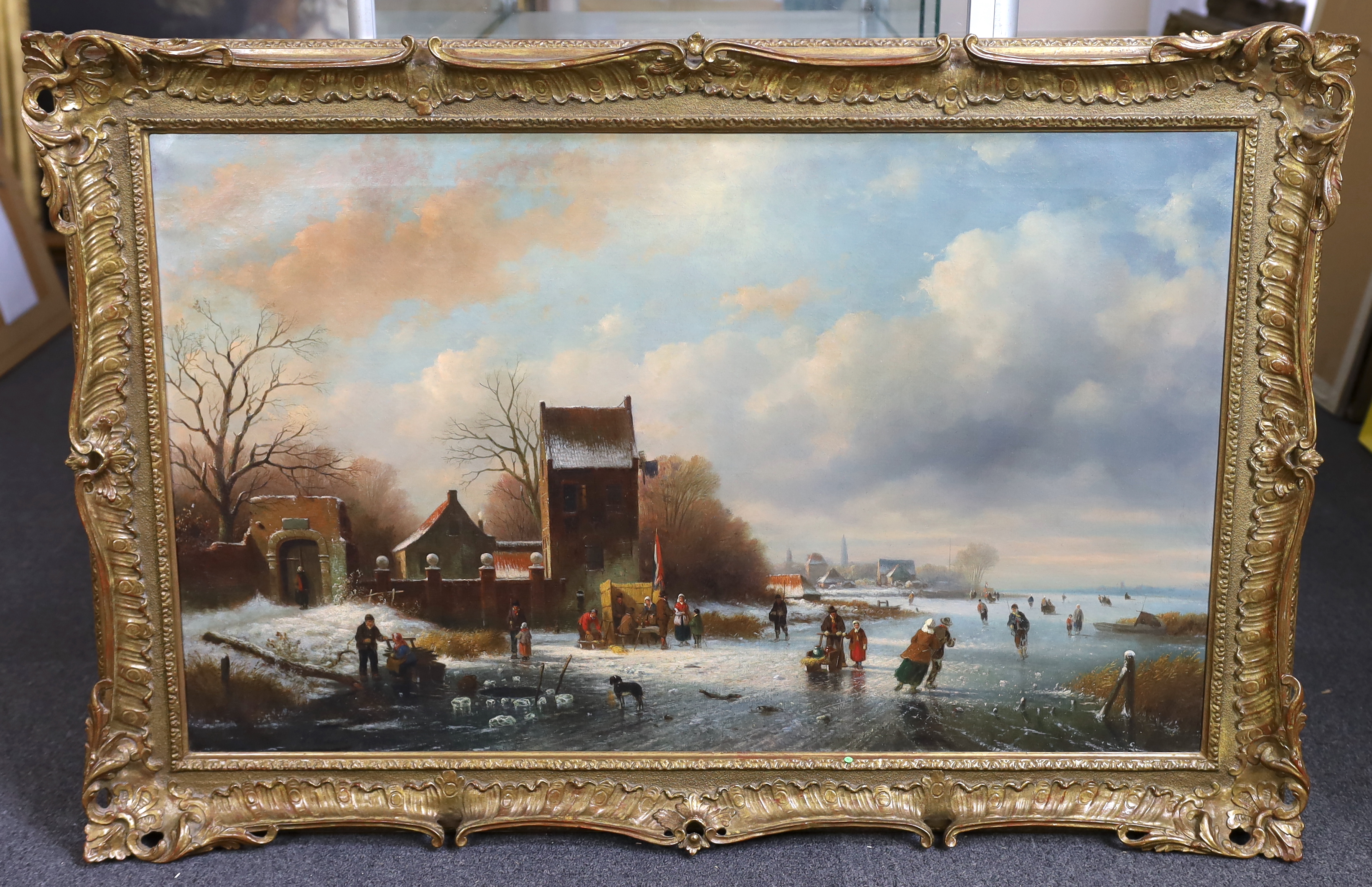 Circle of Frederik Marinus Kruseman (Dutch 1816-1882), Dutch winter landscape with figures skating on a frozen river, oil on canvas, 59 x 97cm, Please note this lot attracts an additional import tax of 5% on the hammer p